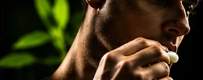 A person reaching for a piece of energy gum
