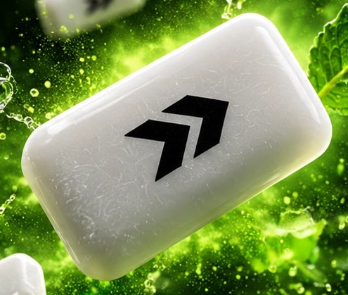 Macro view of a white Switch chewing gum pellet with the double-arrow logo